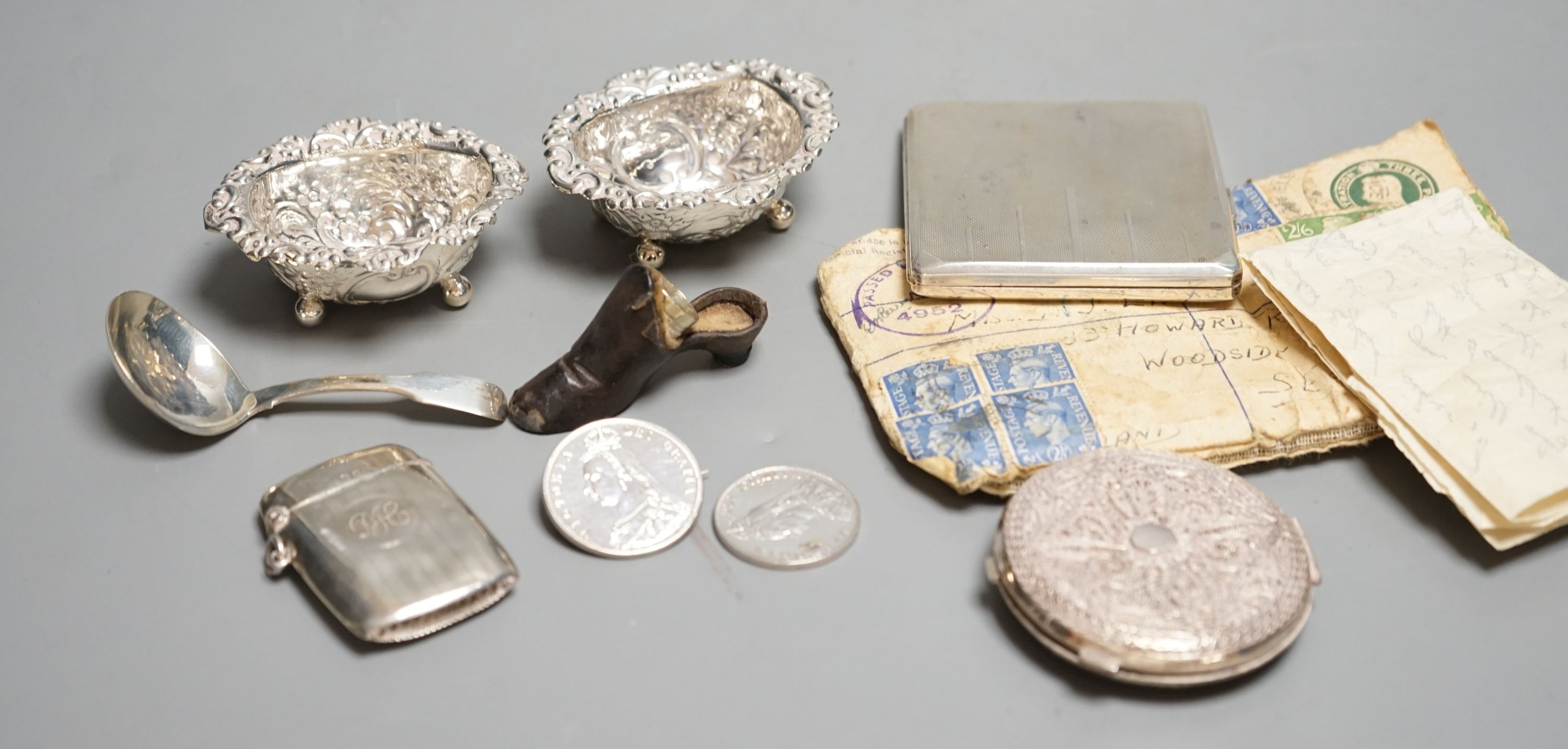 A silver cigarette case, Georgian silver caddy spoon, London, 1817, a pair of silver salts, etc.